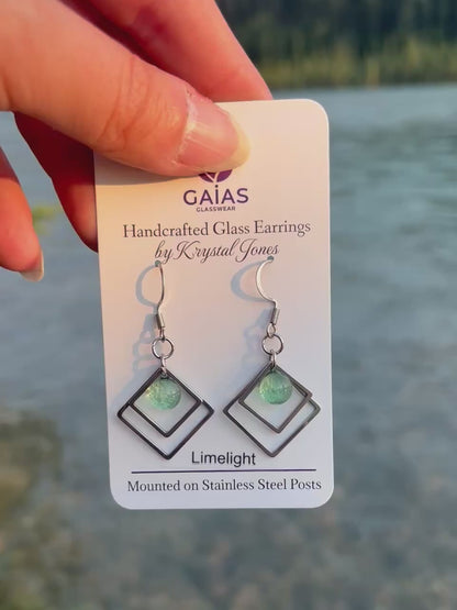 Handmade Limelight geometric fused glass earrings featuring vibrant lime green tones and stainless steel posts, crafted by Canadian glass artist Krystal Jones.