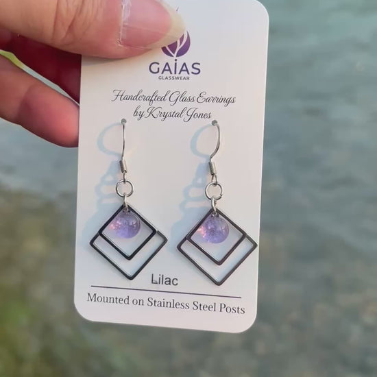 Handmade Lilac geometric fused glass earrings featuring soft purple tones and a modern design with stainless steel posts, crafted by Canadian glass artist Krystal Jones.