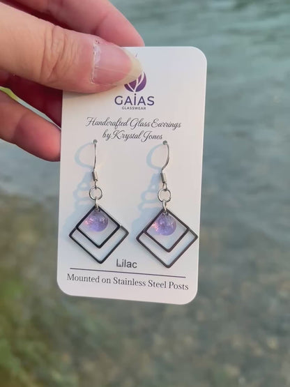 Handmade Lilac geometric fused glass earrings featuring soft purple tones and a modern design with stainless steel posts, crafted by Canadian glass artist Krystal Jones.