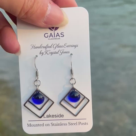Handmade Lakeside geometric fused glass earrings inspired by peaceful waterfront landscapes, featuring nature-inspired colours and stainless steel posts, crafted by Canadian glass artist Krystal Jones.