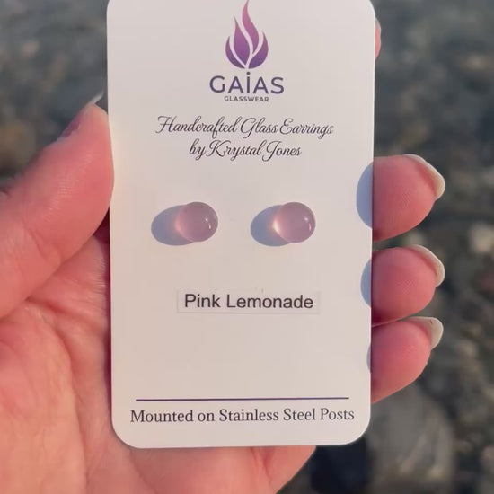 Handmade Pink Lemonade fused glass stud earrings featuring soft pink tones and stainless steel posts, crafted by Canadian glass artist Krystal Jones.