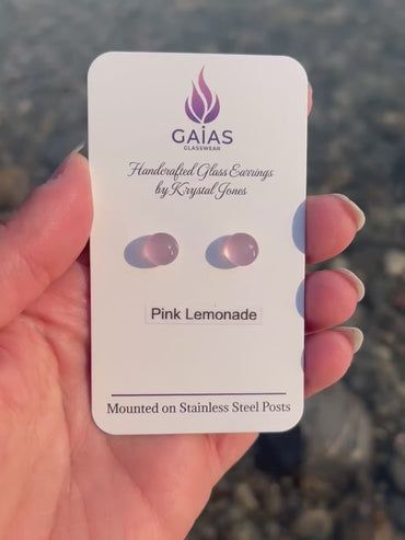 Handmade Pink Lemonade fused glass stud earrings featuring soft pink tones and stainless steel posts, crafted by Canadian glass artist Krystal Jones.