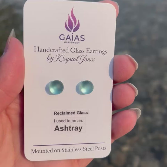 Handmade blue fused glass ashtray earrings by Krystal Jones, featuring a retro-inspired design and stainless steel posts.