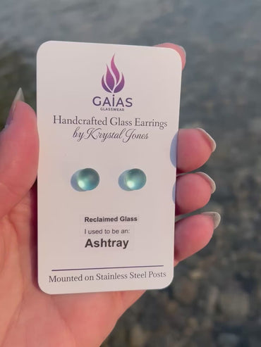 Handmade blue fused glass ashtray earrings by Krystal Jones, featuring a retro-inspired design and stainless steel posts.