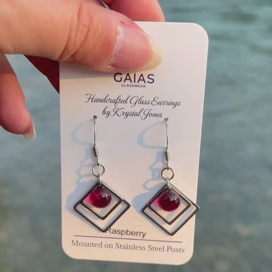 Handmade Raspberry geometric fused glass earrings featuring rich berry-inspired red tones and stainless steel posts, crafted by Canadian glass artist Krystal Jones.