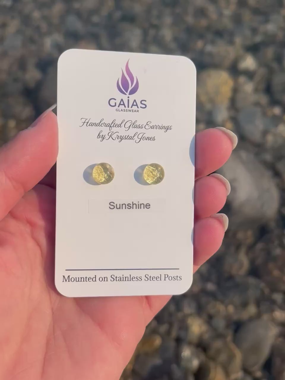 Handmade Sunshine fused glass stud earrings featuring bright yellow tones and stainless steel posts, inspired by the warmth of sunlight and crafted by Canadian glass artist Krystal Jones.