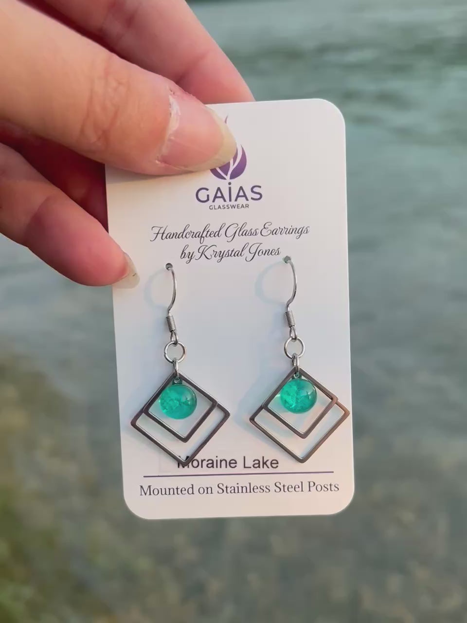 Handmade Moraine Lake geometric fused glass earrings inspired by the turquoise waters of the Canadian Rockies, featuring blue and green tones with stainless steel posts, crafted by Canadian glass artist Krystal Jones.