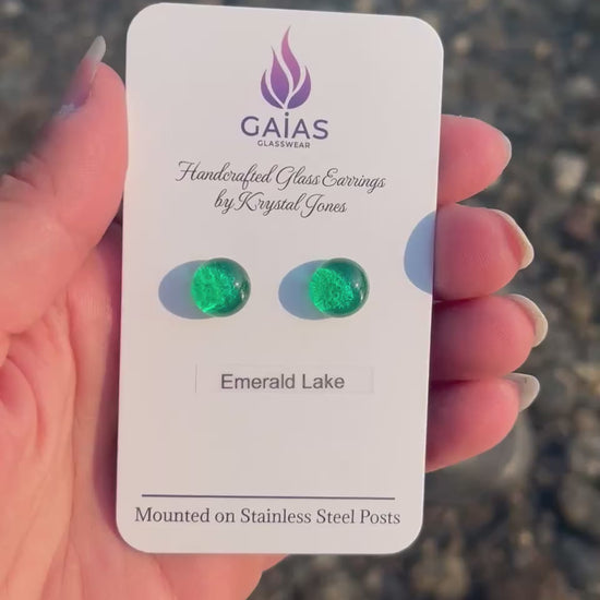 Handmade Emerald Lake fused glass stud earrings inspired by Alberta's turquoise waters, with stainless steel posts, crafted by Canadian glass artist Krystal Jones.