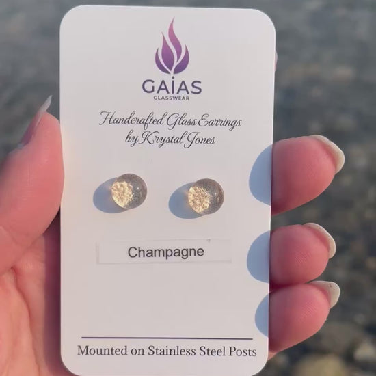 Handmade champagne fused glass stud earrings in elegant neutral tones with stainless steel posts, crafted by Canadian glass artist Krystal Jones.