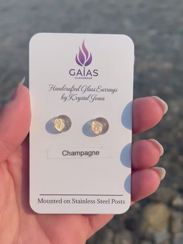 Handmade champagne fused glass stud earrings in elegant neutral tones with stainless steel posts, crafted by Canadian glass artist Krystal Jones.