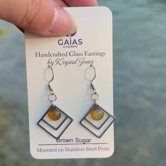 Handmade brown sugar geometric fused glass earrings with warm neutral tones and stainless steel posts, crafted by Canadian glass artist Krystal Jones.