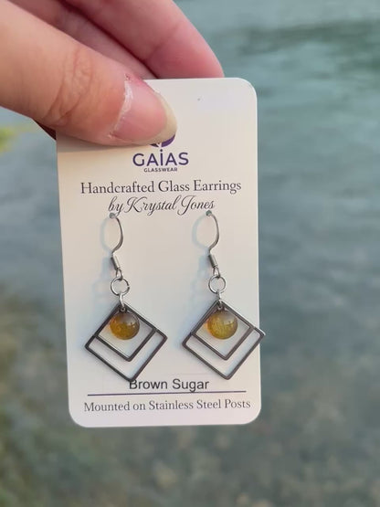 Handmade brown sugar geometric fused glass earrings with warm neutral tones and stainless steel posts, crafted by Canadian glass artist Krystal Jones.