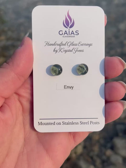 Handmade Envy fused glass stud earrings featuring rich grey tones and stainless steel posts, crafted by Canadian glass artist Krystal Jones.