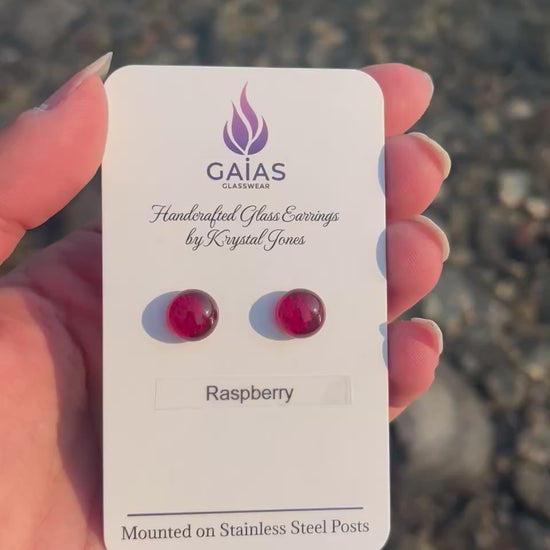 Handmade Raspberry fused glass stud earrings featuring rich berry-inspired red tones and stainless steel posts, crafted by Canadian glass artist Krystal Jones.