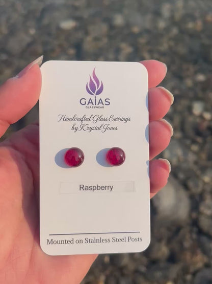 Handmade Raspberry fused glass stud earrings featuring rich berry-inspired red tones and stainless steel posts, crafted by Canadian glass artist Krystal Jones.
