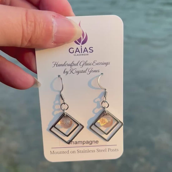 Handmade champagne geometric fused glass earrings with a modern minimalist design and stainless steel posts, crafted by Canadian glass artist Krystal Jones.