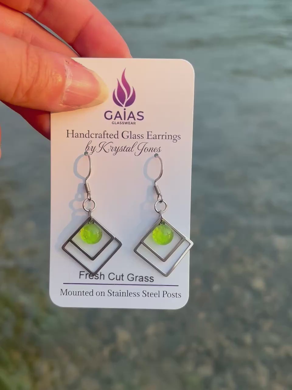 Handmade Fresh Cut Grass geometric fused glass earrings featuring vibrant green tones and a modern design with stainless steel posts, crafted by Canadian glass artist Krystal Jones.
