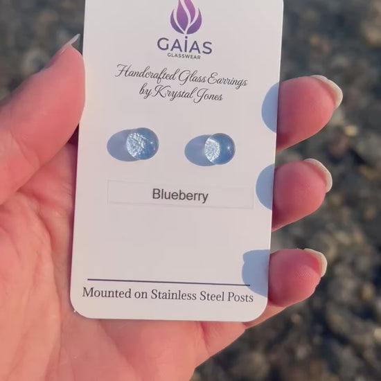 Handmade blueberry-inspired fused glass stud earrings with blue glass berries and stainless steel posts, crafted by Canadian glass artist Krystal Jones.