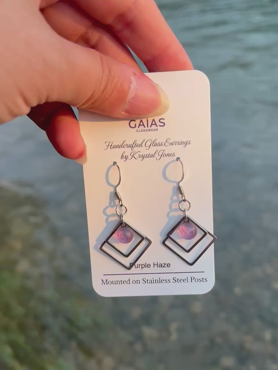 Handmade Purple Haze geometric fused glass earrings featuring rich purple tones and stainless steel posts, crafted by Canadian glass artist Krystal Jones.